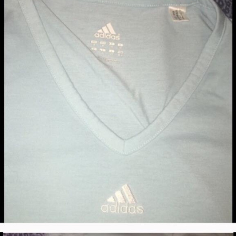 Adidas light blue V neck athletic top.